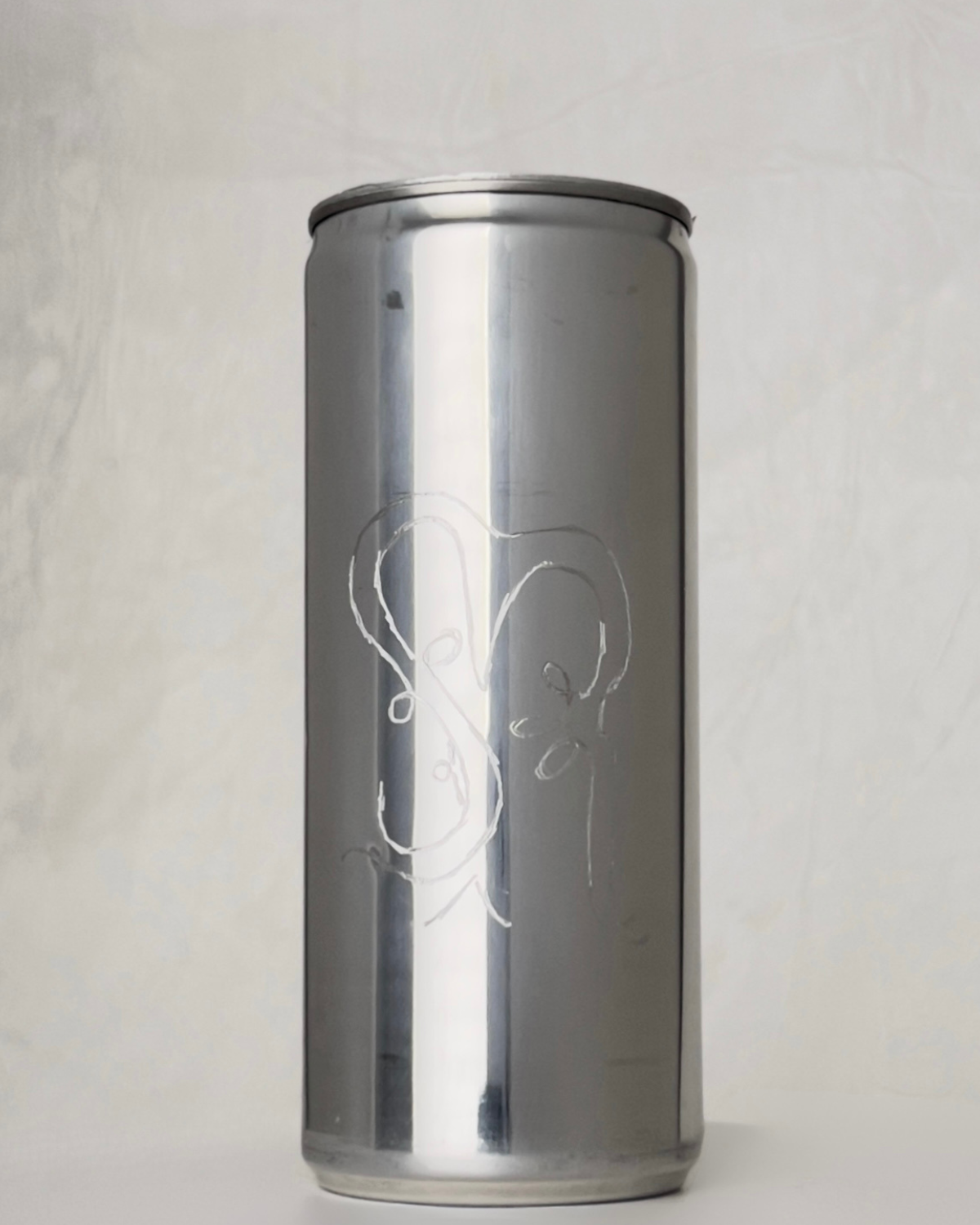 Sloan Rose N°2 Ember & Cream candle in a reclaimed aluminum vessel, engraved with the Sloan Rose monogram